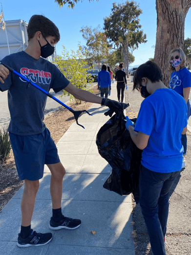 boys cleaning up trash-1